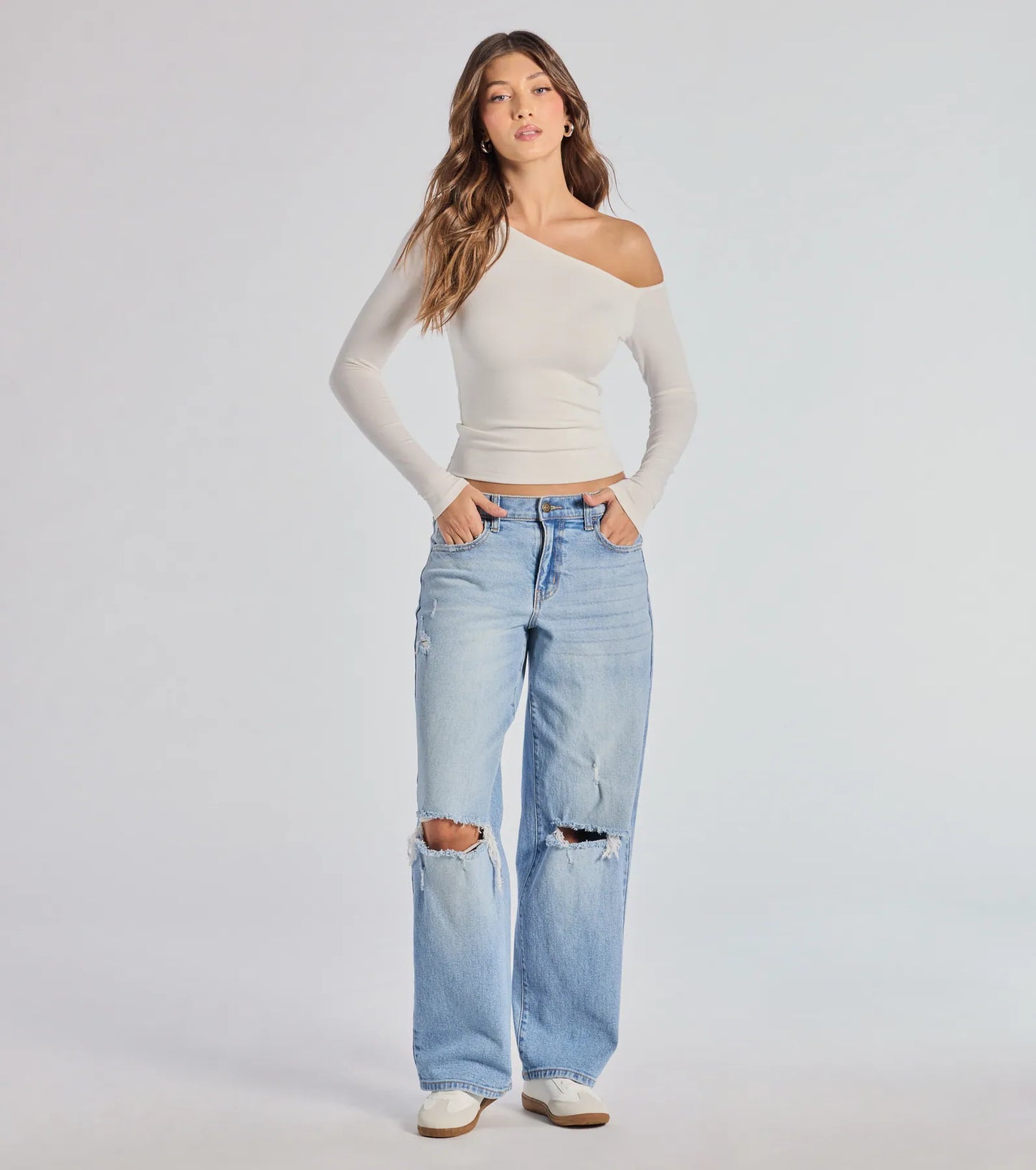 The Chic Factor Asymmetrical Long Sleeve Crop Top in ivory with a modern design and trendy look is part of the latest women's tops collection to elevate your 2025 wardrobe.