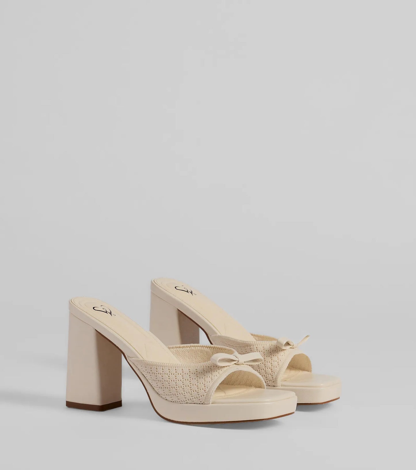 Stay on-trend this season with the Cute Vibes Bow Platform Knit Mules in ivory, a must-have for creating stylish and effortless spring outfits for women.