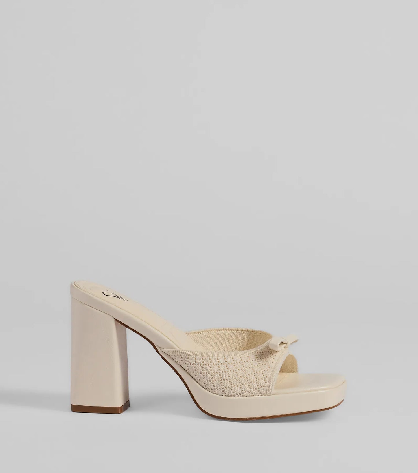 Whether you're dressing up for a romantic date or a Galentine's event, the Cute Vibes Bow Platform Knit Mules in ivory are the perfect accessory to elevate your Valentine's Day outfit.