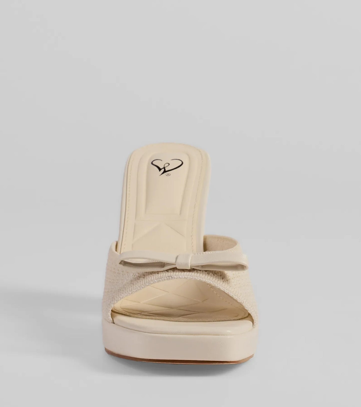 Stay on-trend this season with the Cute Vibes Bow Platform Knit Mules in ivory, a must-have for creating stylish and effortless spring outfits for women.