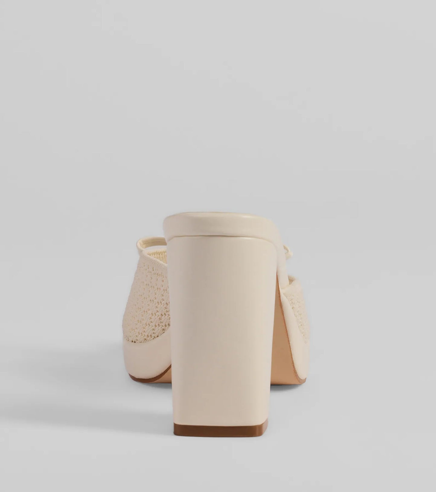 Whether you're dressing up for a romantic date or a Galentine's event, the Cute Vibes Bow Platform Knit Mules in ivory are the perfect accessory to elevate your Valentine's Day outfit.