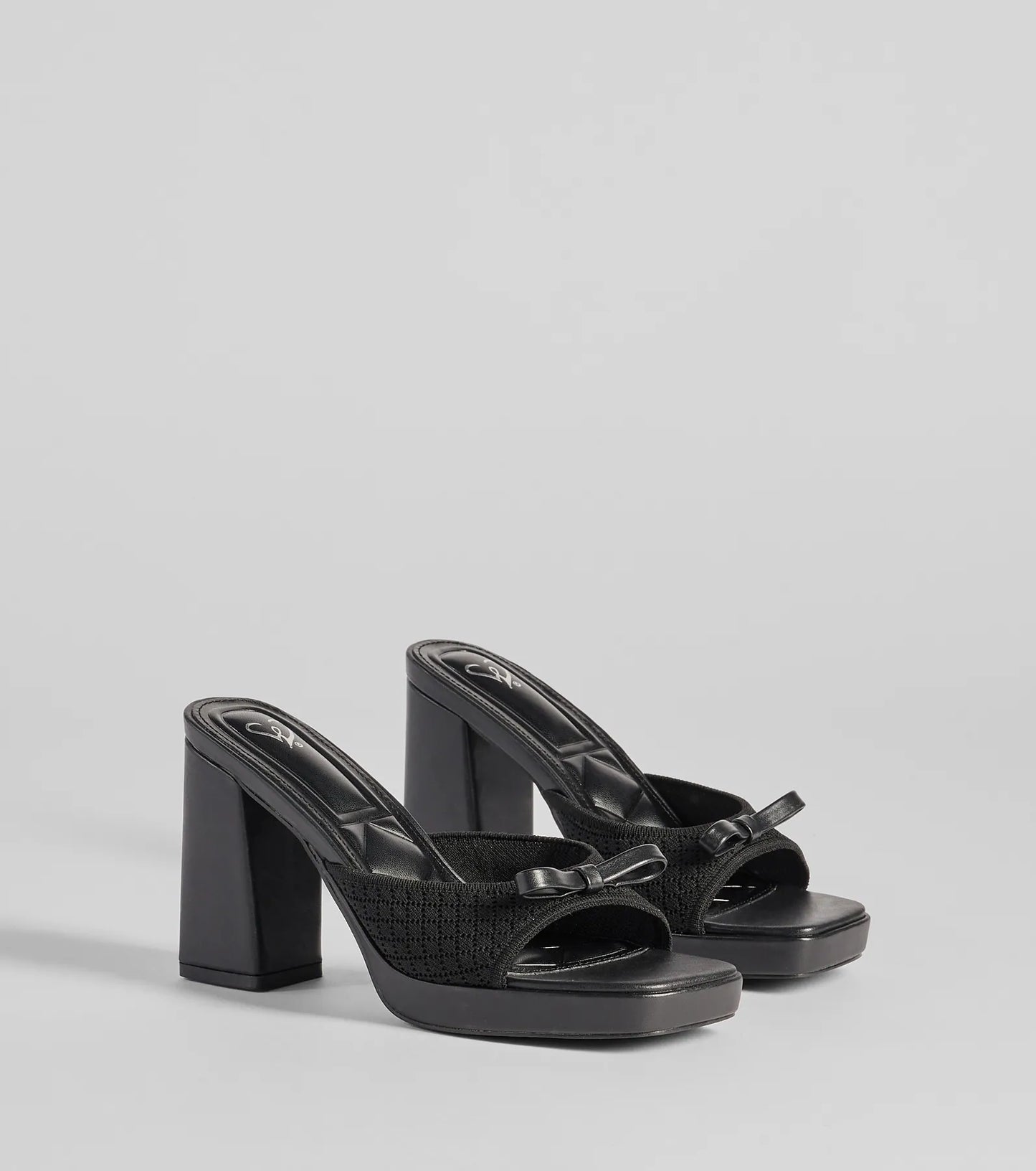Stay on-trend this season with the Cute Vibes Bow Platform Knit Mules in black, a must-have for creating stylish and effortless spring outfits for women.