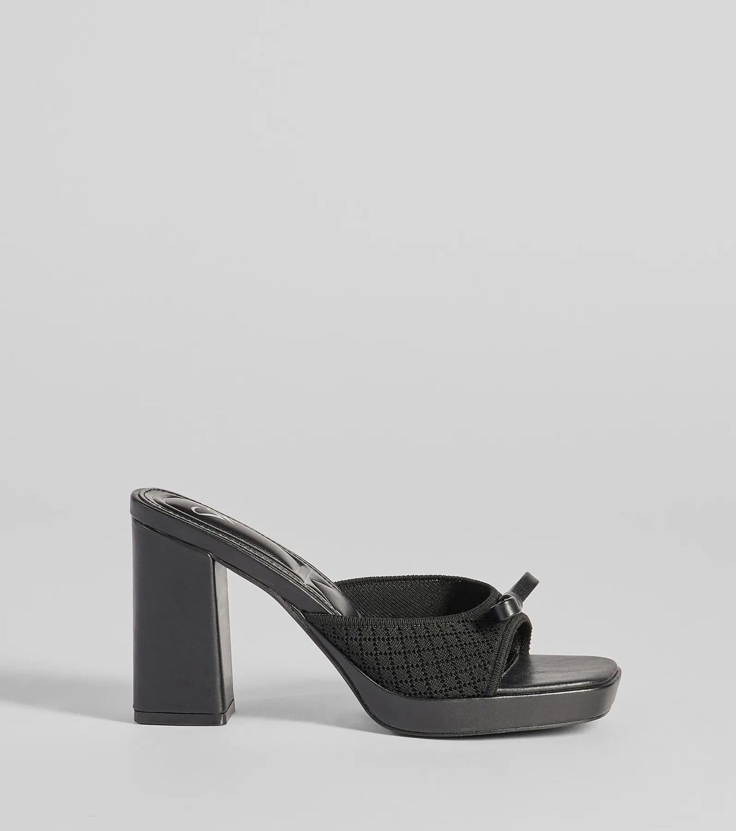 Whether you're dressing up for a romantic date or a Galentine's event, the Cute Vibes Bow Platform Knit Mules in black are the perfect accessory to elevate your Valentine's Day outfit.
