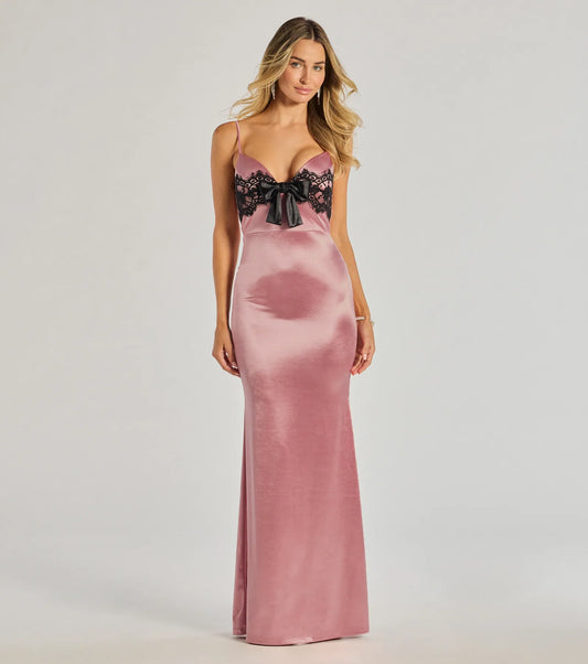 Turn heads at Prom 2025 in this blush prom dress, where statement-making details meet the iconic style of the Jayden V-Neck Lace Trim Bow Satin Mermaid Formal Dress .